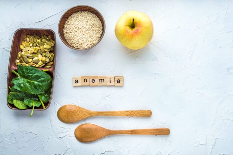 Spinach Pumpkin Seeds Sesame Apple Two Wooden Spoons White Background Anemia Concept Close Up 1024X681 1